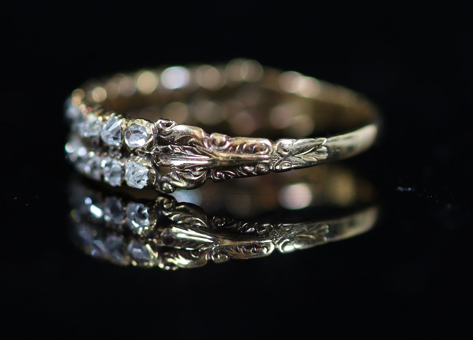 A 19th century gold and twin row old mine cut diamond set half hoop ring